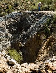 Car plunges into mineshaft, 2 Dead, 1 Missing